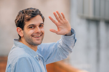 Wall Mural - portrait of man in the street waving