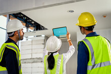 Construction Engineer Team Uses Technology Software Through Tablets To Scan Building Construction And Inspection To Show Augmented Reality In Work, Building Information Model, BIM Concept