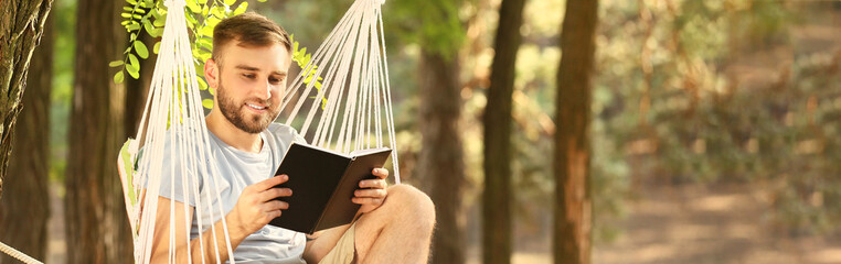 Canvas Print - Young man reading book and relaxing in hammock outdoors