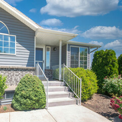 Sticker - Square White puffy clouds Facade of a house with shrubs, trees and lawn at the front