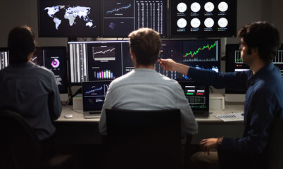 team of financial analysts working in the office.