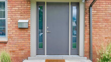 Panorama Modern Gray Front Door With Two Side Panels And Mailbox On The Side