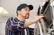 © auremar - technician repairing bicycle in his workshop