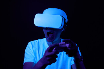 Wall Mural - man with virtual reality headset is playing game.