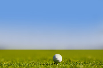 Sport golf ball on sky background with copy space.