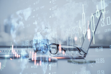 Poster - Global trading and stock market concept with foggy digital interface with world map and forex market indicators and candlesticks on office workplace background with laptop and glasses