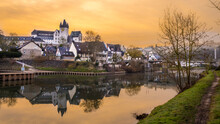 Germany, Rhineland-Palatinate, Diez, Diez Castle And Surrounding Houses Reflecting In River Lahn At Dusk