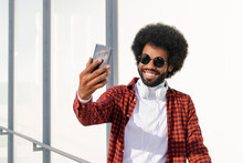 Happy Man Wearing Sunglasses Taking Selfie Through Smart Phone