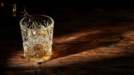 Poster - Super slow motion of pouring whiskey into glass. Placed on old wooden table. Filmed on high speed cinema camera, 1000fps.