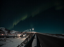 Long Exposure Shot, Photo Of Bridge, Road And Cars In Norway Lofoten With Big Mountains During Night