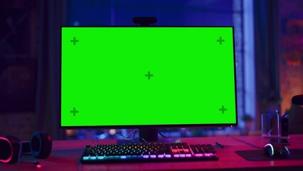 Fototapete - Gaming at Home: Empty Gaming Station with Player's Personal Computer with Green Screen Chroma Key Display Standing on a Wooden Desk in Stylish Loft Apartment with Neon Lights. Zoom Out Shot.
