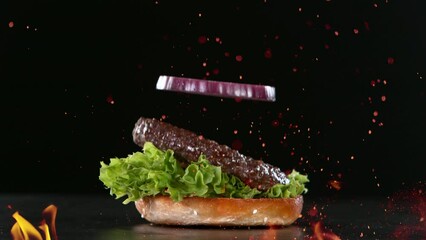 Wall Mural - Beef Burger Ingredients Falling and Landing in the Bun. Super Slow Motion at 1000 fps.