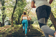 © BalanceFormCreative - A group of people exercise and run at the park.They were running up the stairs.