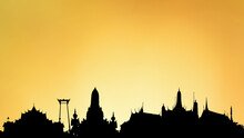 Silhouette With Wat Arun ,wat Phra Kaeo And The Marble Temple On Gold Background.