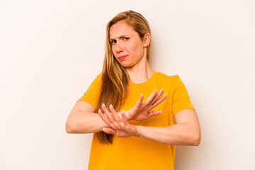 Young caucasian woman isolated on white background doing a denial gesture