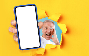 Poster - Excited man showing white empty smartphone screen through torn paper