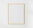 Wooden blank frame on white wall mockup, 4:5 ratio - 40x50 cm, 16 x 20 inches, poster frame mockup, 3d rendering