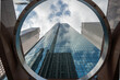 © L.I. Drone Shots  - Looking up skyscraper through circle architecture in downtown Houston, Texas