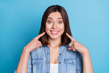Photo Of Pretty Adorable Lady Dressed Denim Shirt Pointing Fingers White Teeth Isolated Blue Color Background