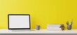 Blank computer laptop screen and various items on desktop workspace in yellow wall home office room. 3D renering illustration.