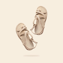 Summer Female Wicker Sandals Isolated On Beige Background. Fashionable Trendy Rope Straw Sandals. Jute Slippers. Handmade Eco-friendly Natural Shoes. Cut Out Objects For Design, Mock Up