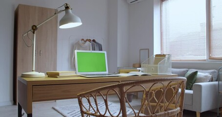 Interior of room with modern laptop at workplace 