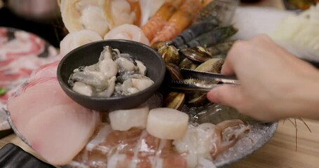 Wall Mural - Bowl of seafood for hotpot in restaurant