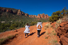 Girls On Winter Hiking Trip In Sedonas. Women Walking  On Bell Rock Loop And  Courthouse Buttle Loop Trai. Just South Of Sedona, Arizona,USA.