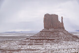 Fototapeta Paryż - Classic southwest desert landscape with snow on the ground in Monument Valley
in Arizona and Utah.