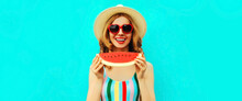Summer Portrait Of Happy Young Woman Eating Fresh Tasty Slice Of Watermelon Wearing Straw Hat, Red Heart Shaped Sunglasses On Blue Background, Blank Copy Space For Advertising Text
