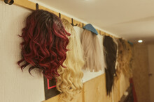 Wigs, Natural And Synthetic Hair. Women's Beauty Concept. Close Up Photo Of Wig, Hair For Ladies.