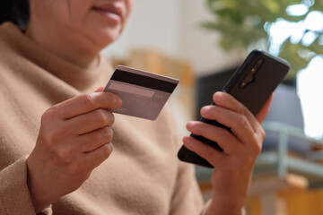 Poster - close up hand use credit card pay contactless online in mobile app shopping