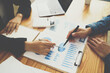 © PaeGAG - Financial advisor, accounting and Investment concept, business owners consult adviser financial meeting to analyze and on the finance report in the office room.