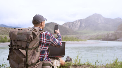 Wall Mural - Freelancer using digital devices in the countryside