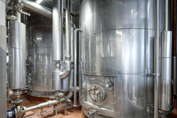 Wall Mural - Large yeast fermentation tanks. Industrial production of beer