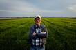 © Zoran Zeremski - Portrait of senior farmer standing in barley field at sunset.