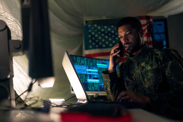 American hacker in military unifrorm on dark web, cyberwar concept.
