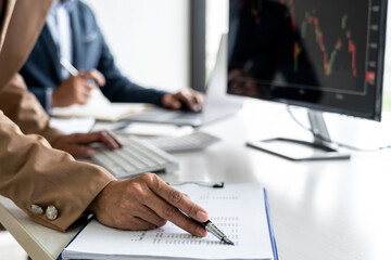 Poster - Business team partner working with computer, laptop, discussion and analyzing graph stock market trading with stock chart data planning, financial and investment concept