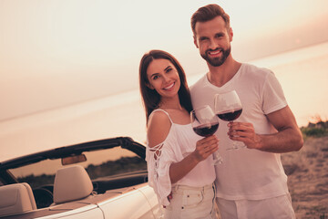 Poster - Photo of charming cute young husband wife dressed casual outfits riding cabriolet drinking wine outside nature countryside