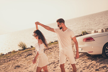 Poster - Photo of young couple happy positive smile have fun dance beach car seaside romantic summer nature outdoors