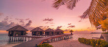 Amazing Sunset Panorama At Maldives. Luxury Resort Villas Seascape With Palm Leaves Under Colorful Sky. Beautiful Romantic Sky And Colorful Clouds. Beautiful Beach Vacation Holiday, Island Paradise