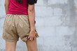© buraratn - Woman wearing shorts itchy legs Scratch with your hands to relieve itching..