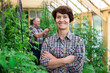 © caftor - Portrait of happy elderly woman posing in the greenhouse