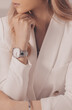 Stylish beautiful white watch on woman hand.