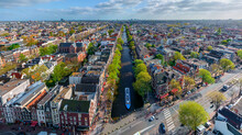 Panoramic Aerial View Of Colourful Buildings In Amsterdam With Canals, The Netherlands.