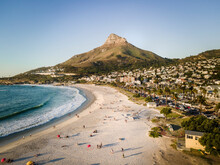 Aerial View Of Camps Bay Beach With Lion’s Head Mountain In Background, Cape Town, South Africa.