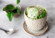 Green Spinach Coconut Ice Cream In Ceramic Bowl On Gray Background. Clean Eating, Vegan Food. Top View. Soft Focus