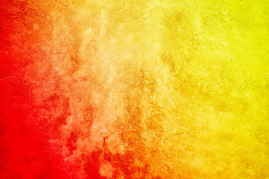 Wall Mural -  - Bright abstract yellow orange red background. Toned rough surface texture. Colorful background with space for design.