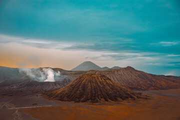 Wall Mural - Bromo Tengger Semeru National Park in Indonesia, with calderas, mountains, and a colorful sky