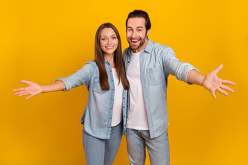 Wall Mural - Photo of good mood excited sister brother dressed denim shirts ready hug you isolated yellow color background